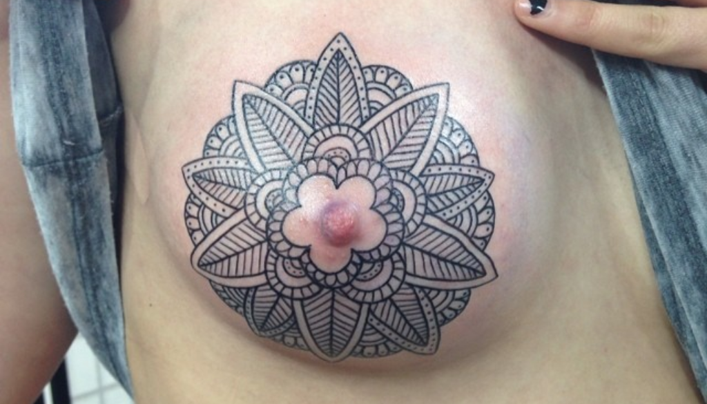 lotus flower nipple. mandala nipple tattoo Westminster. 